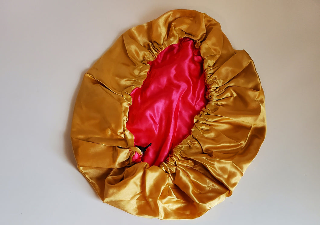 Reversible satin bonnet Gold/Pink